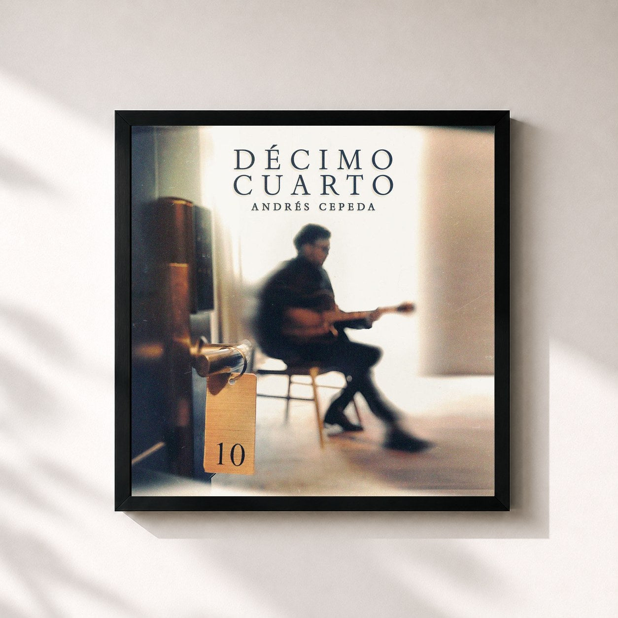 #noir Tableau carré de l'album Décimo Cuarto de Andrés Cepeda, cadre noir 32x32 cm