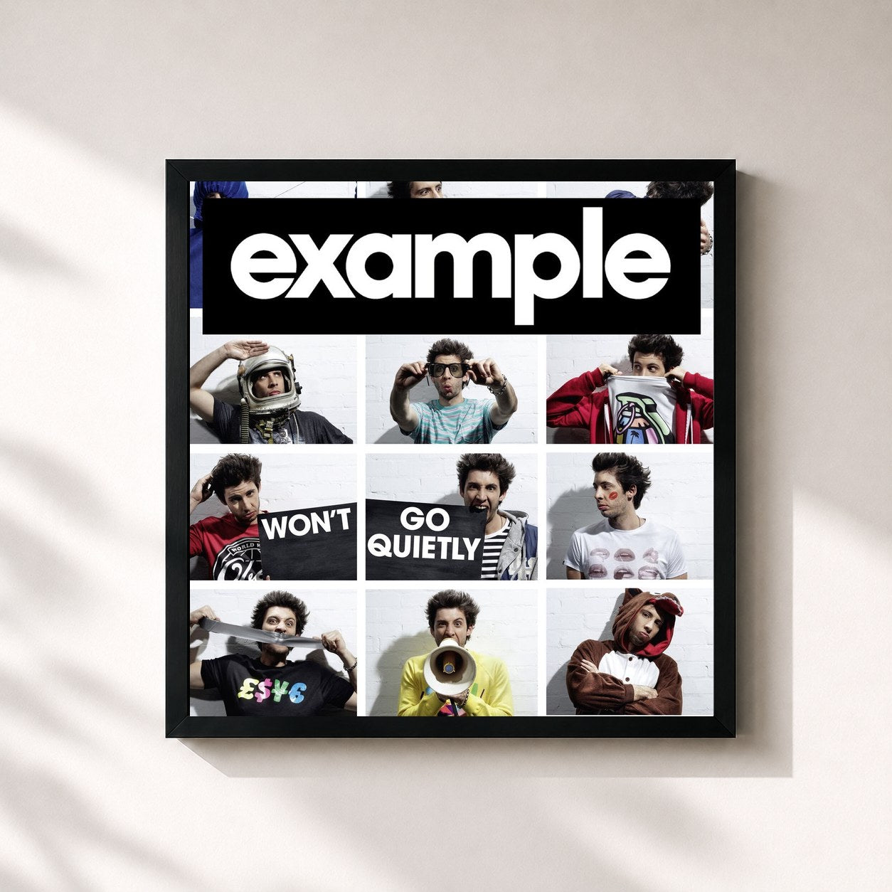 #noir Tableau carré de l'album Won't Go Quietly de Example, cadre noir 32x32 cm