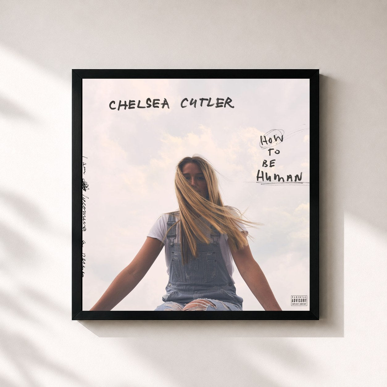 #noir Tableau carré de l'album How To Be Human de Chelsea Cutler, cadre noir 32x32 cm