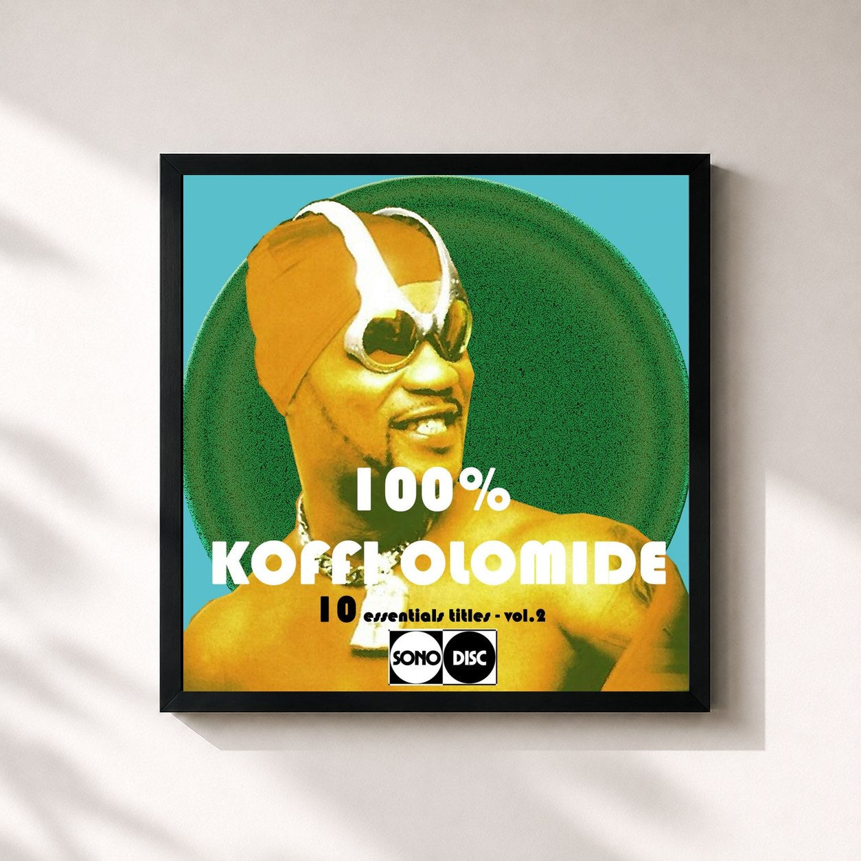 #noir Tableau carré de l'album 100% Koffi Olomide, vol. 2 (10 Essentials Titles) de Koffi Olomidé, cadre noir 32x32 cm