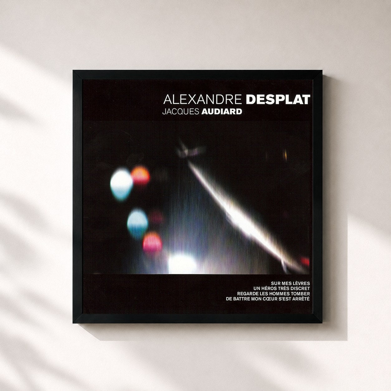 #noir Tableau carré de l'album Alexandre Desplat / Jacques Audiard de Alexandre Desplat, cadre noir 32x32 cm