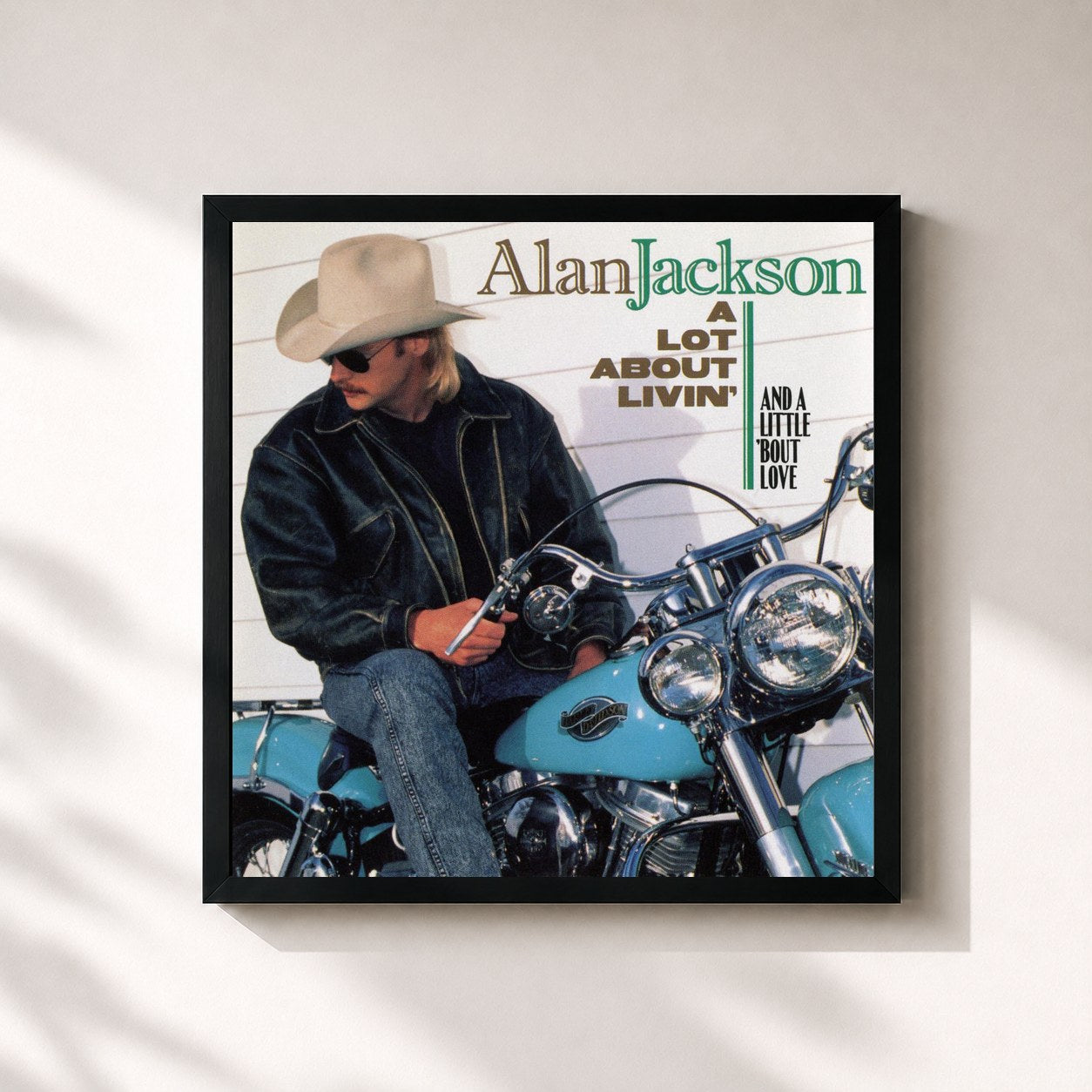 #noir Tableau carré de l'album A Lot About Livin' (And A Little 'Bout Love) de Alan Jackson, cadre noir 32x32 cm