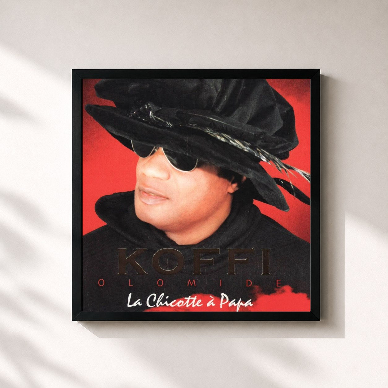 #noir Tableau carré de l'album La chicotte à papa de Koffi Olomidé, cadre noir 32x32 cm