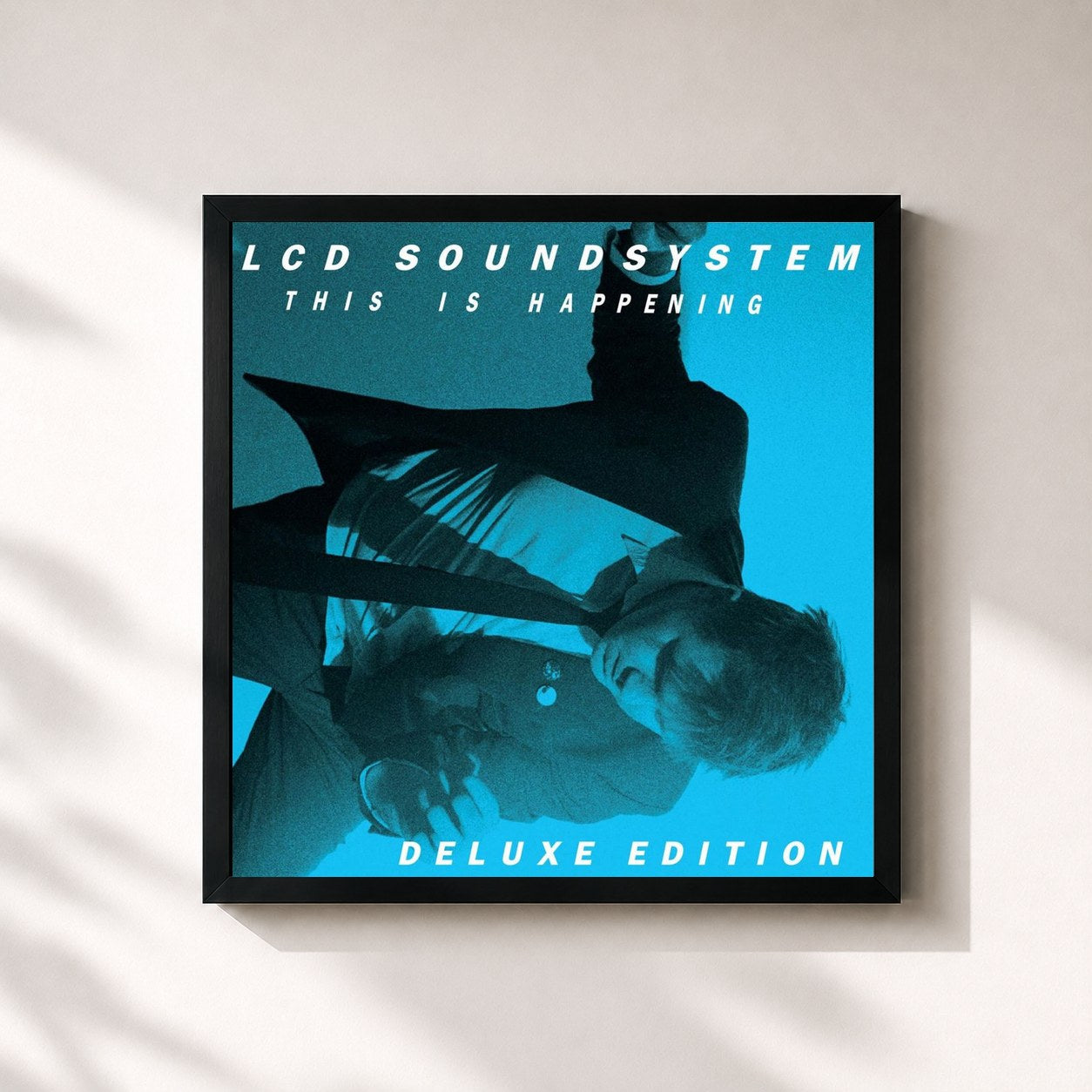 #noir Tableau carré de l'album This Is Happening (Deluxe Edition) de LCD Soundsystem, cadre noir 32x32 cm