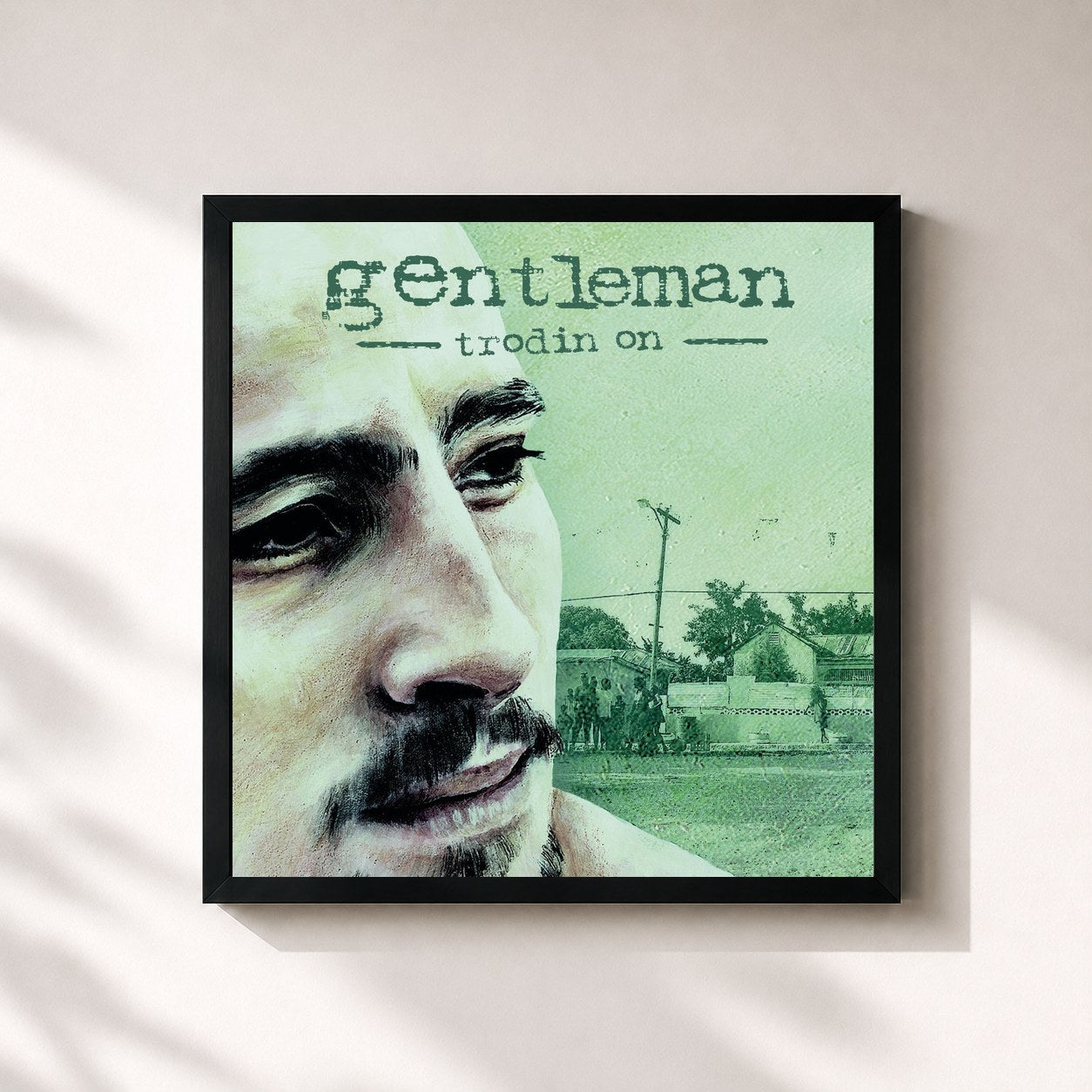 #noir Tableau carré de l'album Trodin On de Gentleman, cadre noir 32x32 cm