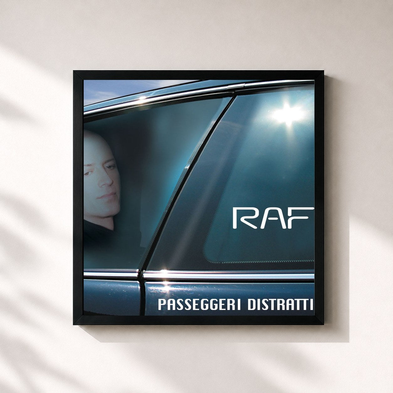 #noir Tableau carré de l'album Passeggeri Distratti de Raf, cadre noir 32x32 cm