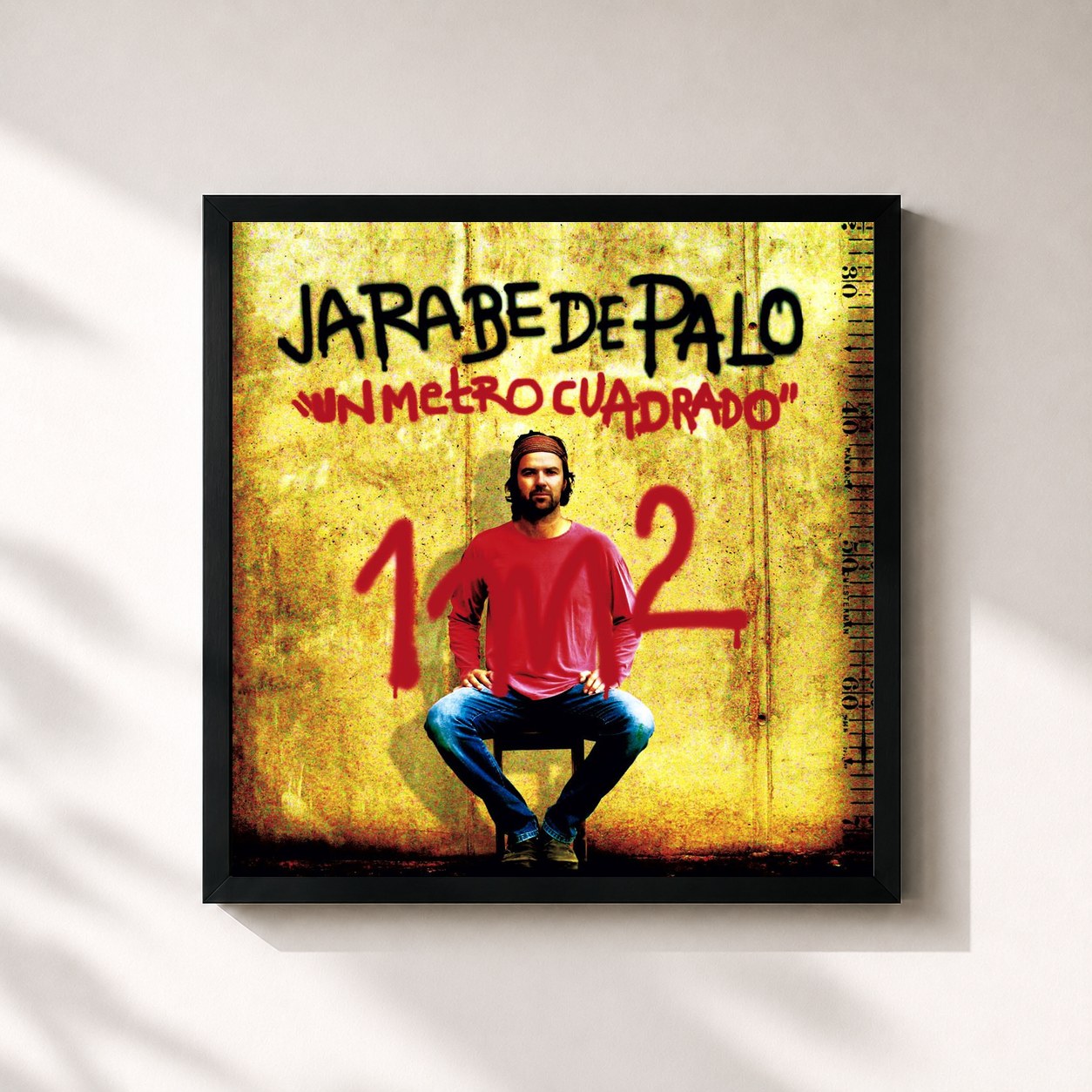 #noir Tableau carré de l'album Un metro cuadrado de Jarabe de Palo, cadre noir 32x32 cm