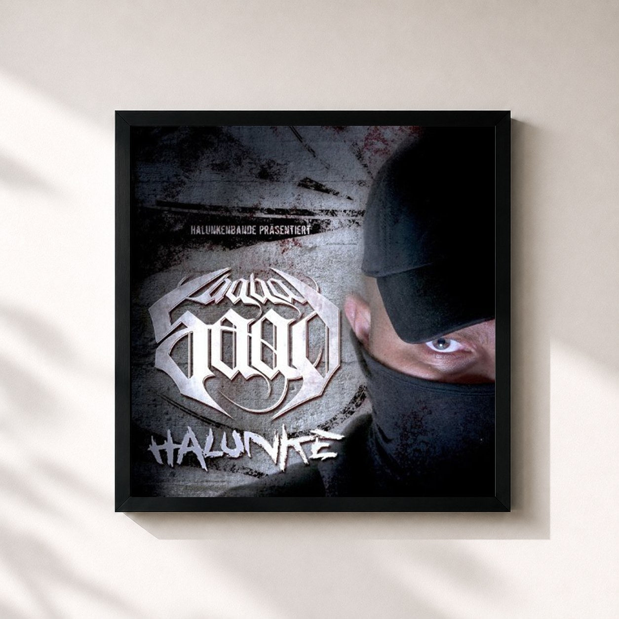 #noir Tableau carré de l'album Halunke de Saad, cadre noir 32x32 cm