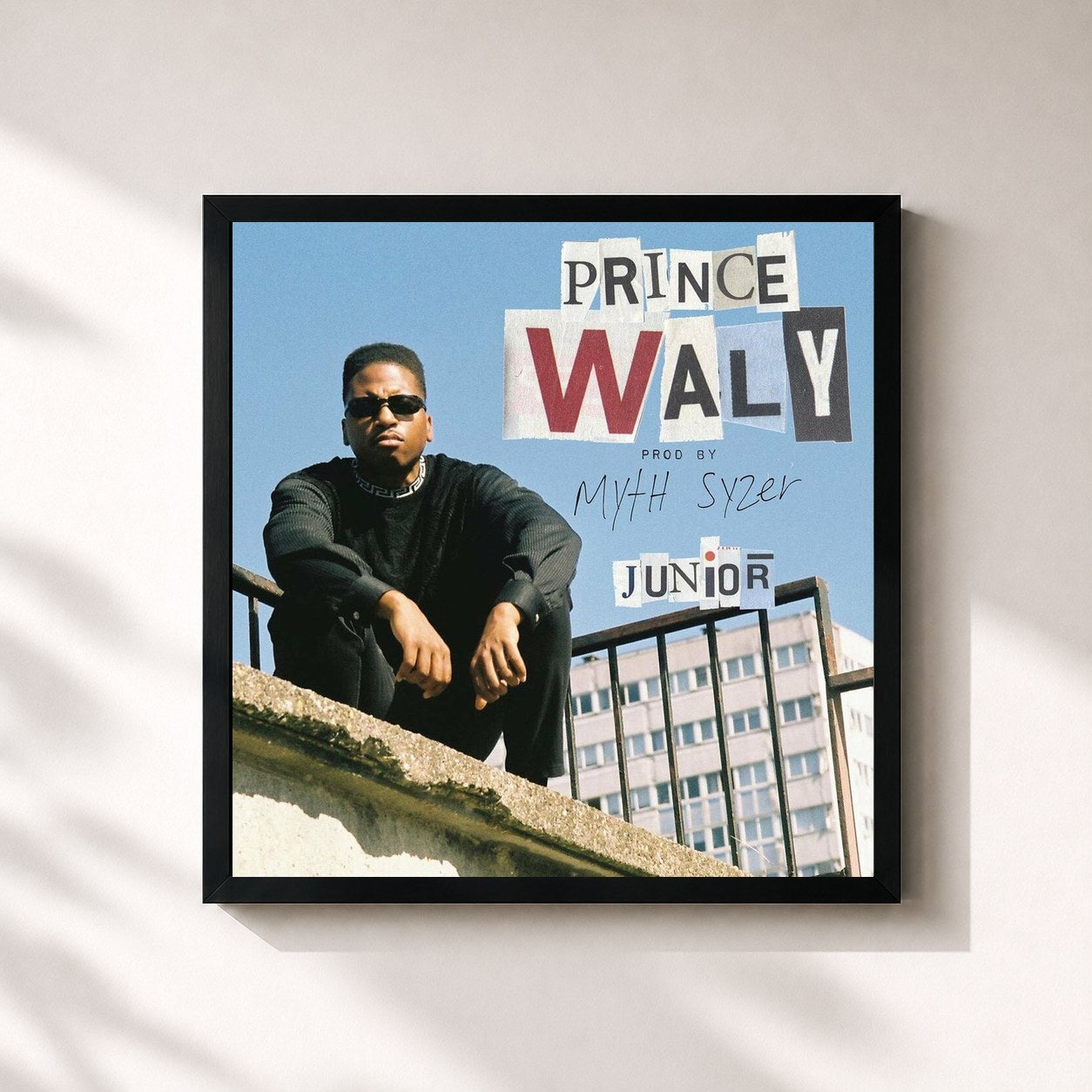 #noir Tableau carré de l'album Junior de Prince Waly, cadre noir 32x32 cm
