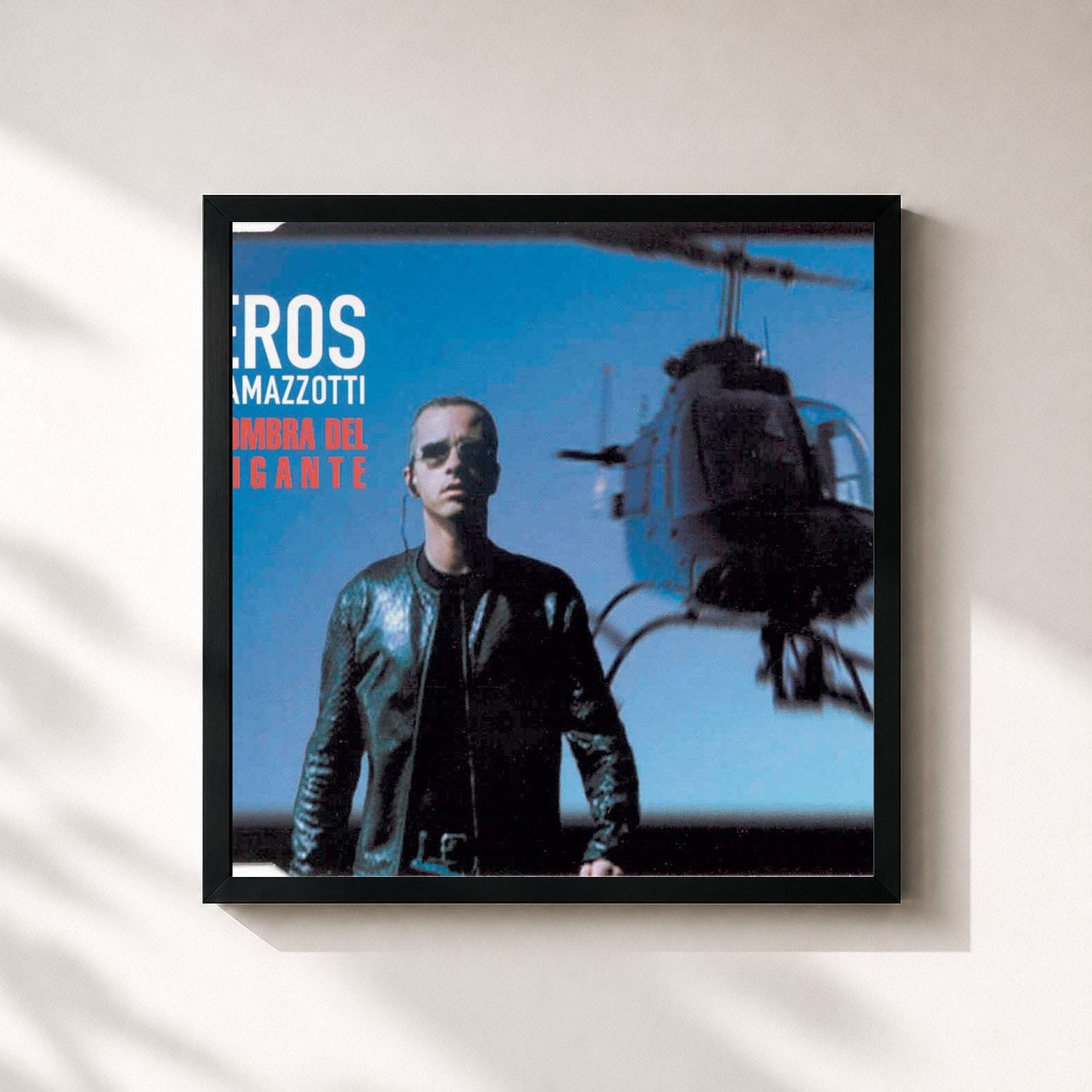 #noir Tableau carré de l'album L'Ombra Del Gigante de Eros Ramazzotti, cadre noir 32x32 cm