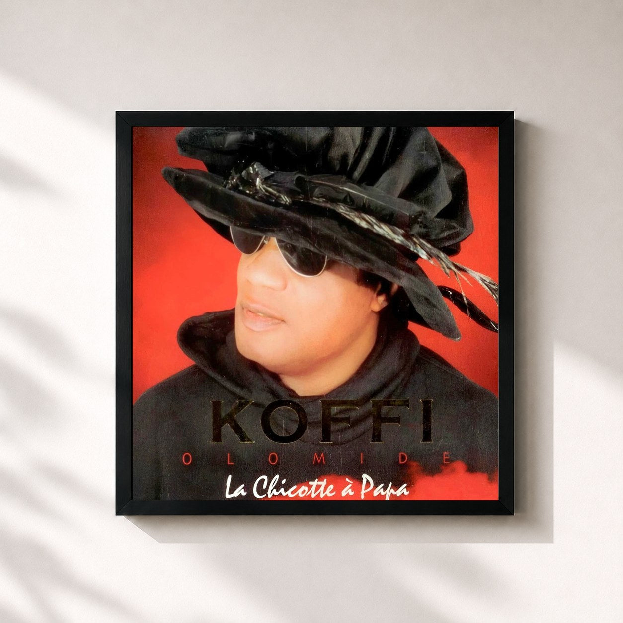 #noir Tableau carré de l'album La chicotte à Papa de Koffi Olomidé, cadre noir 32x32 cm