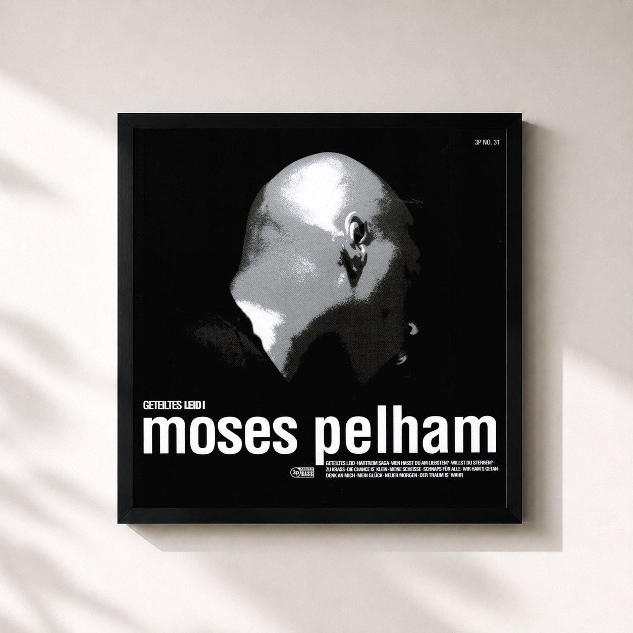 #noir Tableau carré de l'album Geteiltes Leid I de Moses Pelham, cadre noir 32x32 cm