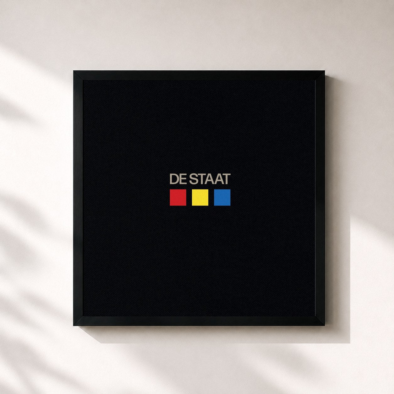 #noir Tableau carré de l'album Red / Yellow / Blue de De Staat, cadre noir 32x32 cm