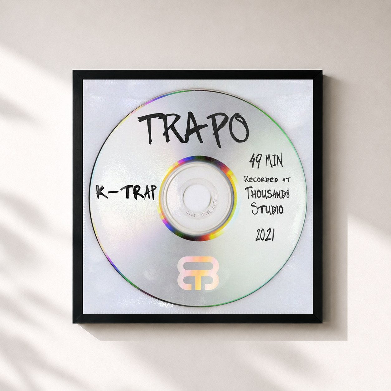 #noir Tableau carré de l'album Trapo de K-Trap, cadre noir 32x32 cm
