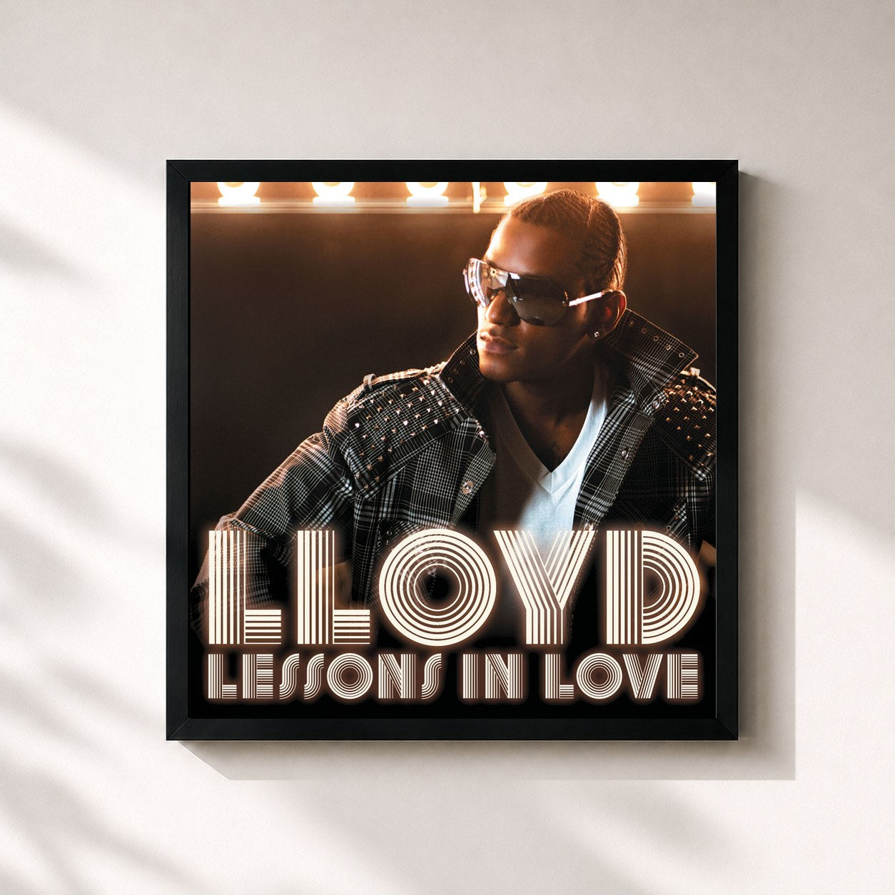 #noir Tableau carré de l'album Lessons In Love de Lloyd, cadre noir 32x32 cm