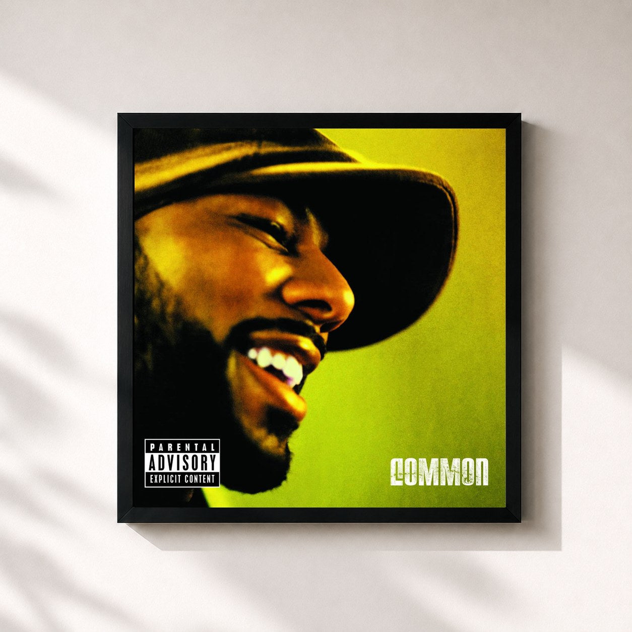 #noir Tableau carré de l'album Be de Common, cadre noir 32x32 cm