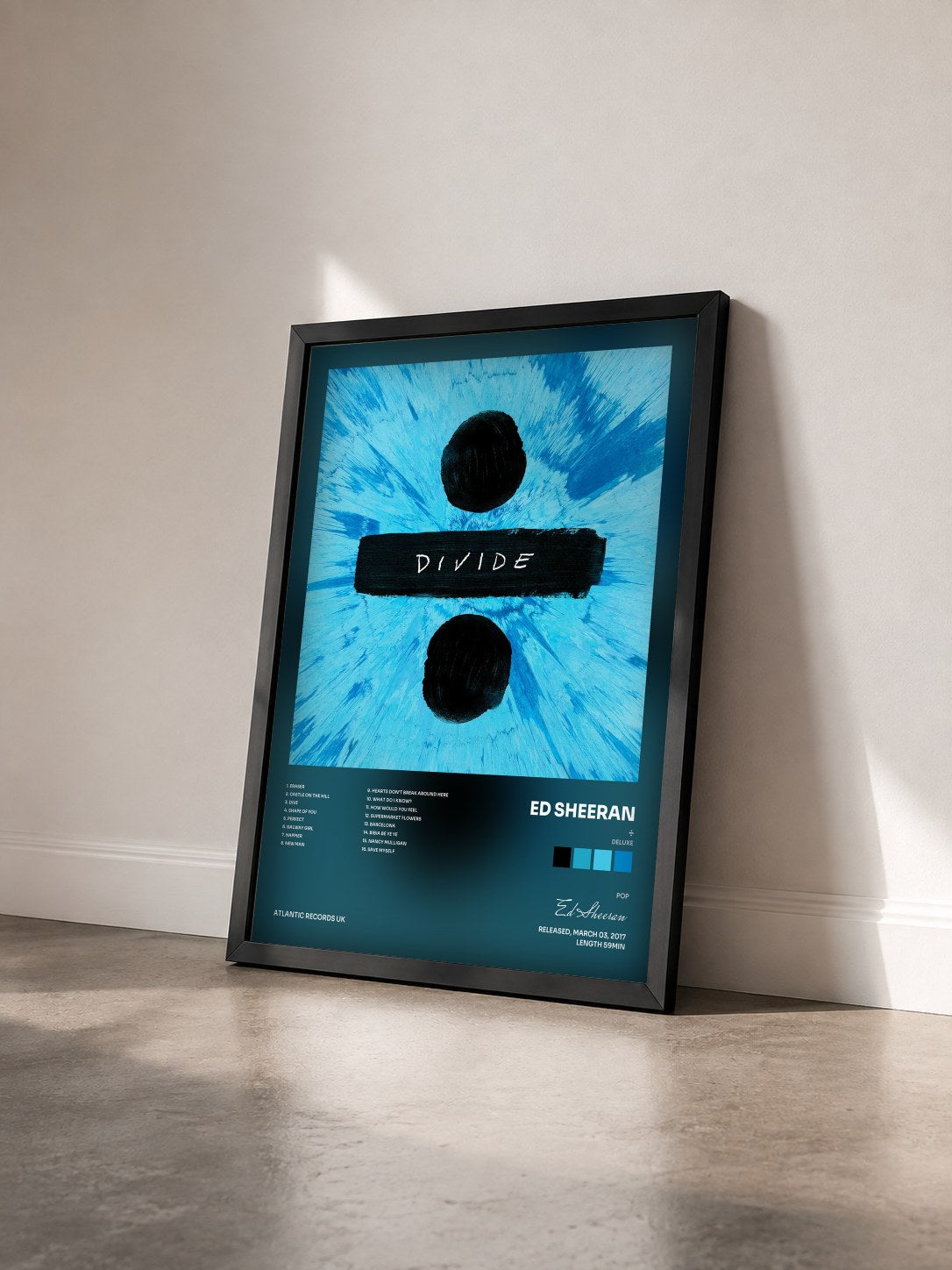 #noir Tableau de l'album ÷ (Deluxe) de Ed Sheeran vu de trois quarts, cadre noir
