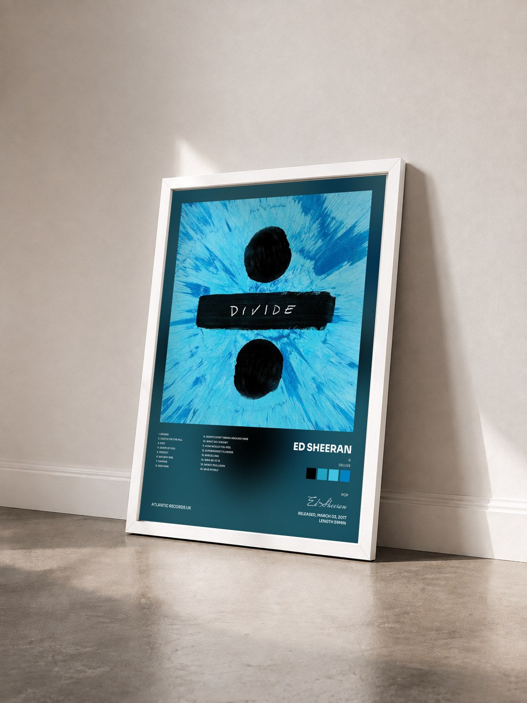 #blanc Tableau de l'album ÷ (Deluxe) de Ed Sheeran vu de trois quarts, cadre blanc