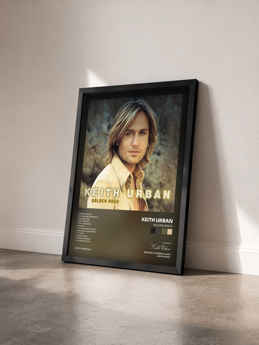 #noir Tableau de l'album Golden Road de Keith Urban vu de trois quarts, cadre noir