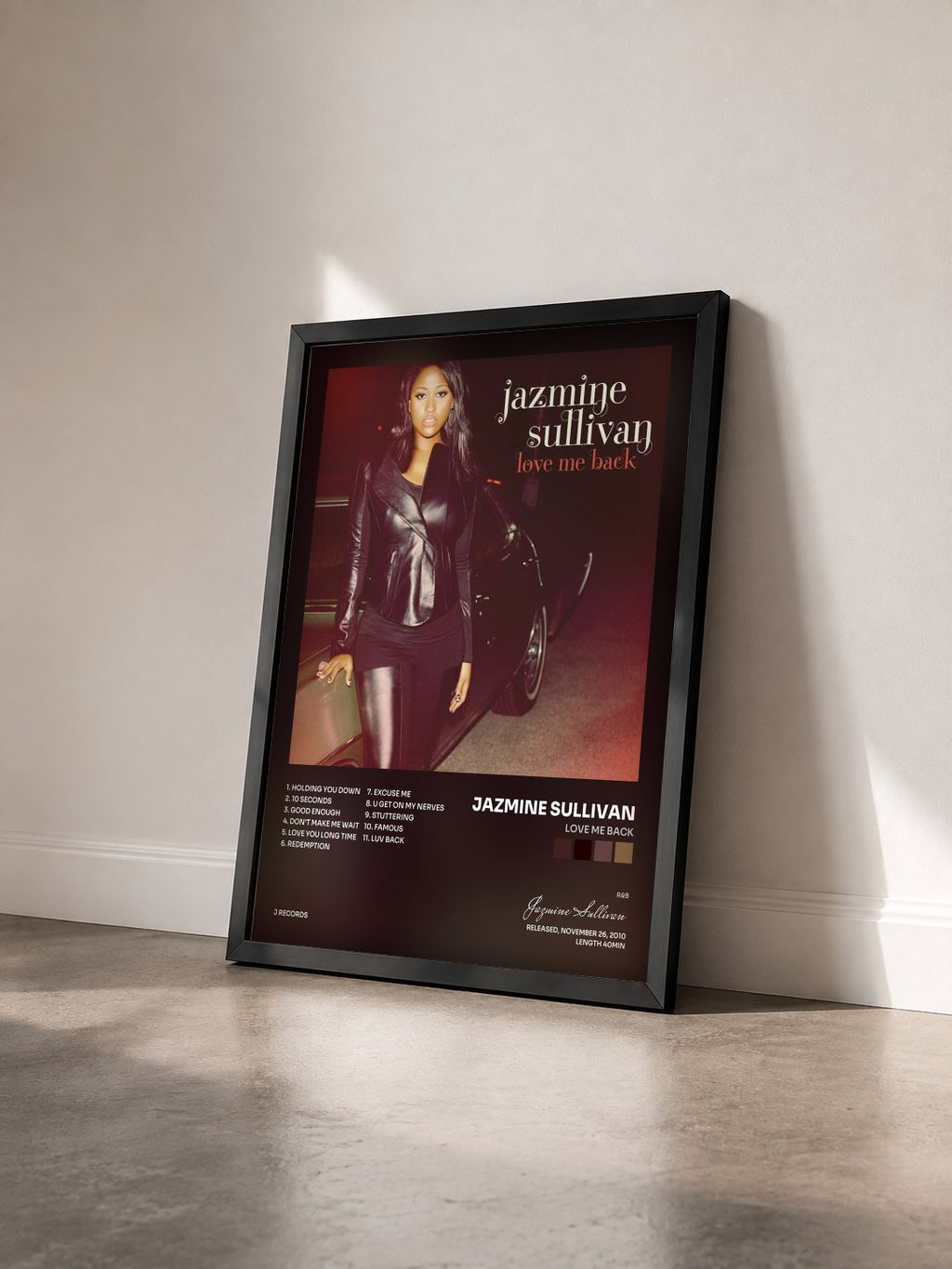 #noir Tableau de l'album Love Me Back de Jazmine Sullivan vu de trois quarts, cadre noir