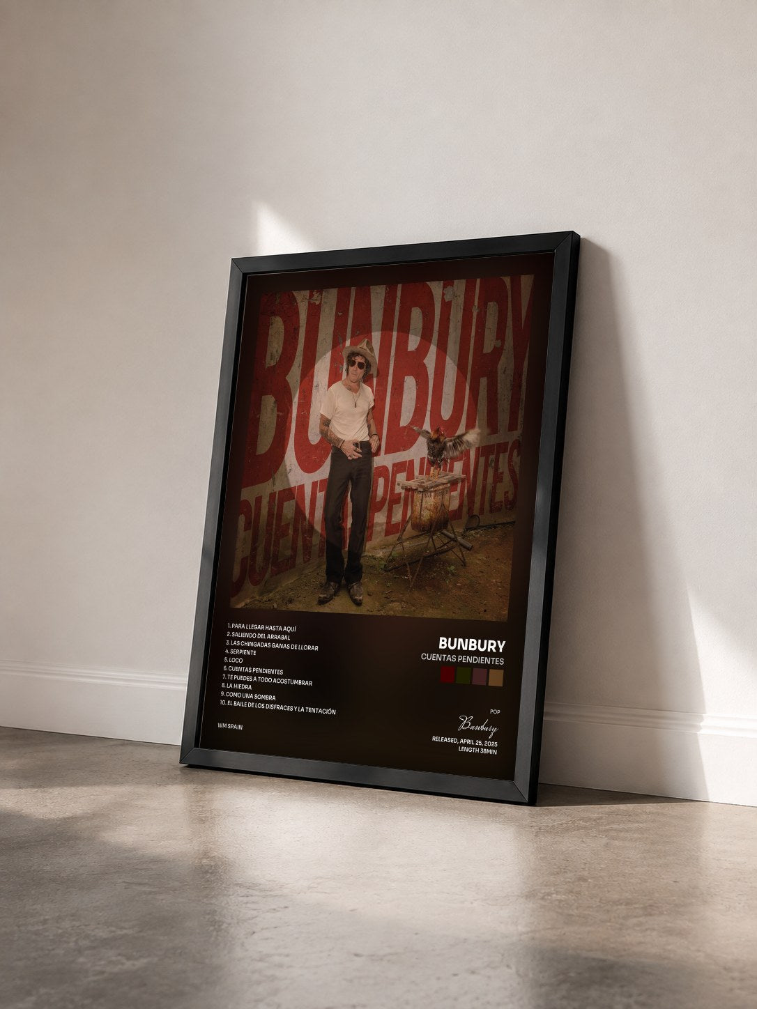 #noir Tableau de l'album Cuentas pendientes de Bunbury vu de trois quarts, cadre noir
