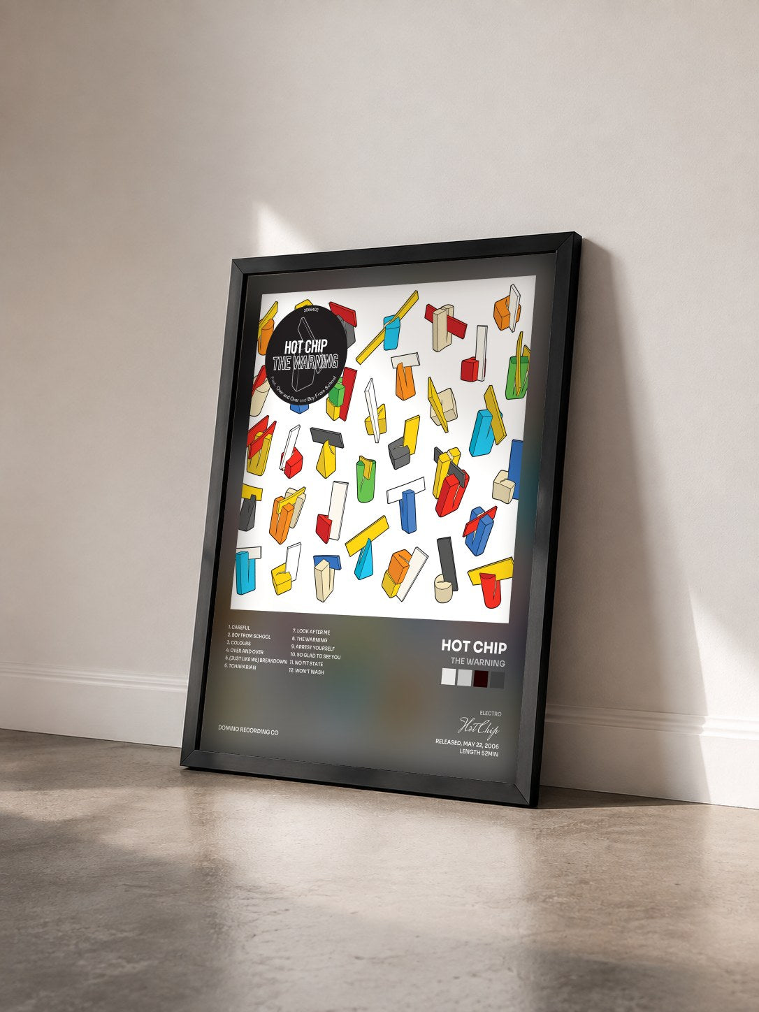 #noir Tableau de l'album The Warning de Hot Chip vu de trois quarts, cadre noir