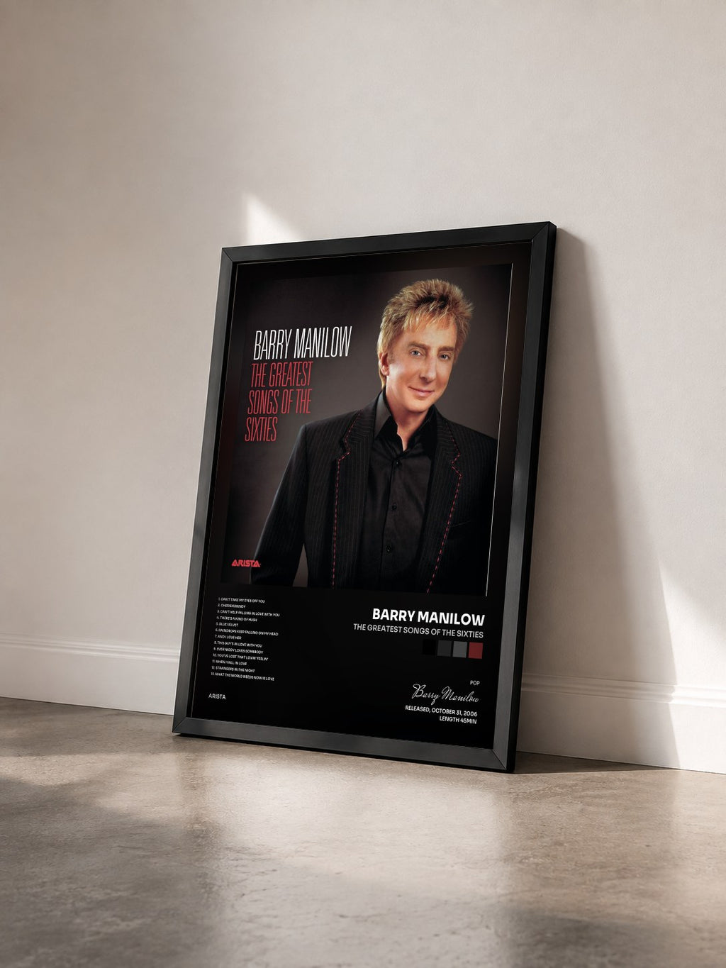 #noir Tableau de l'album The Greatest Songs Of The Sixties de Barry Manilow vu de trois quarts, cadre noir