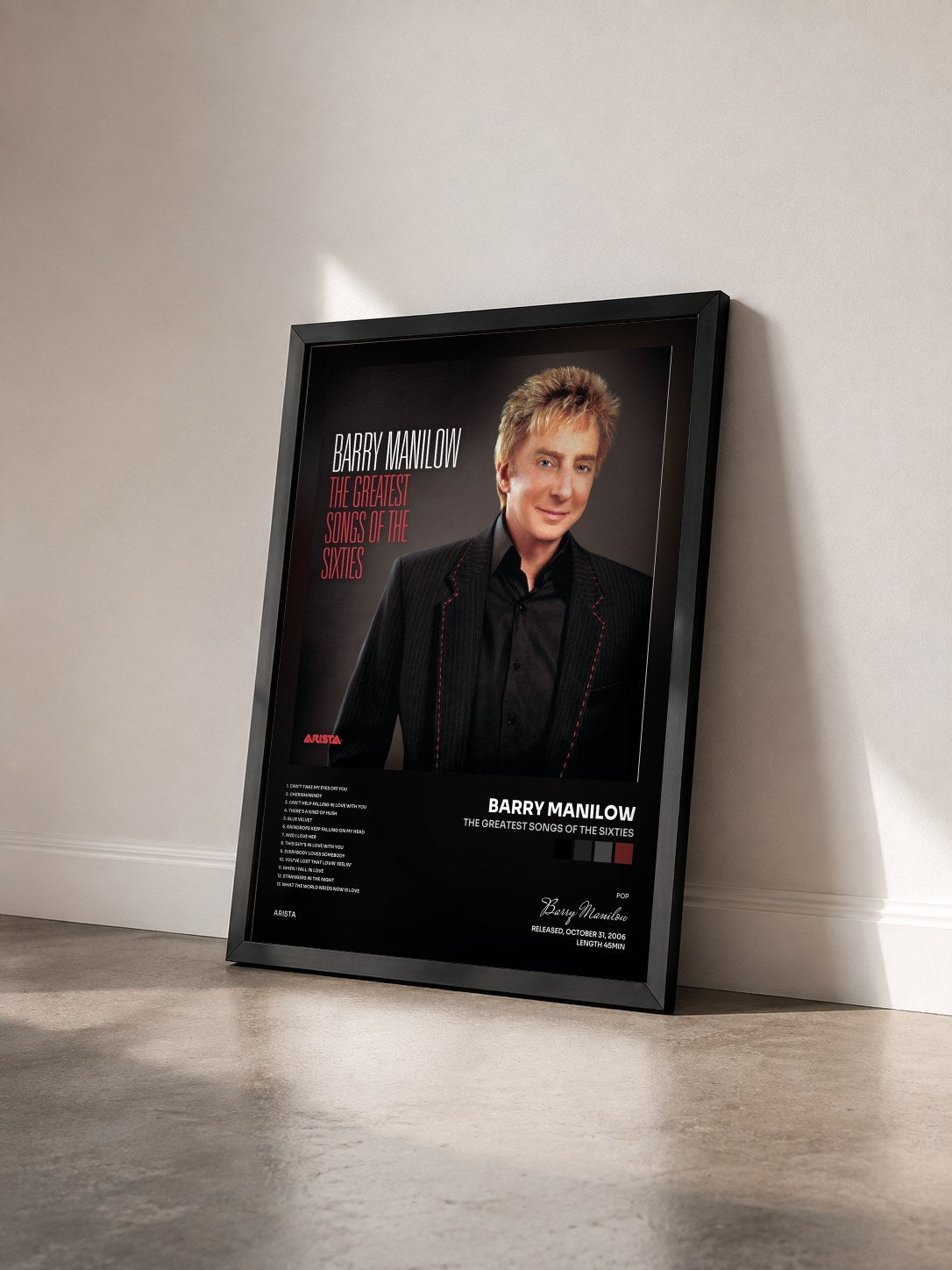 #noir Tableau de l'album The Greatest Songs Of The Sixties de Barry Manilow vu de trois quarts, cadre noir