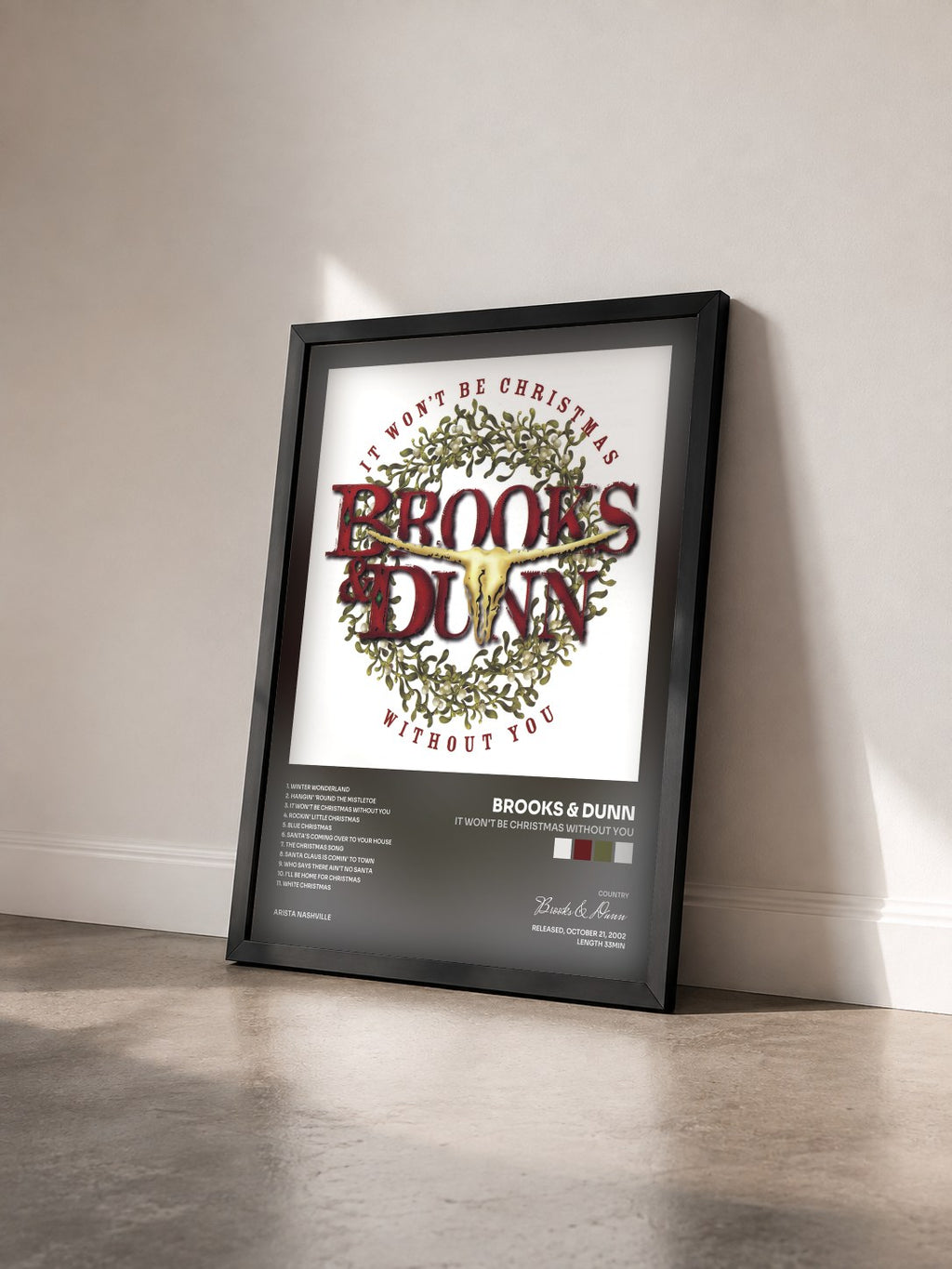 #noir Tableau de l'album It Won't Be Christmas Without You de Brooks & Dunn vu de trois quarts, cadre noir