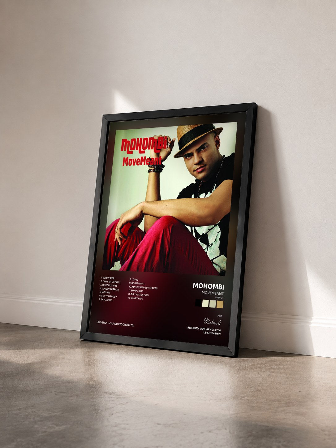 #noir Tableau de l'album MoveMeant (French) de Mohombi vu de trois quarts, cadre noir