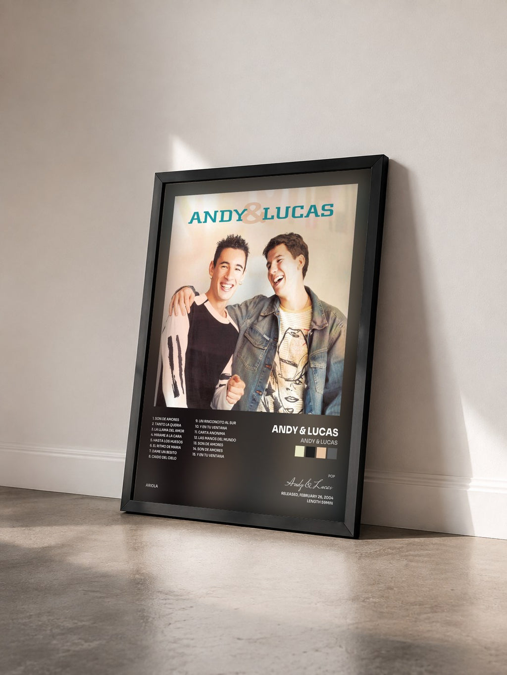 #noir Tableau de l'album Andy & Lucas de Andy & Lucas vu de trois quarts, cadre noir