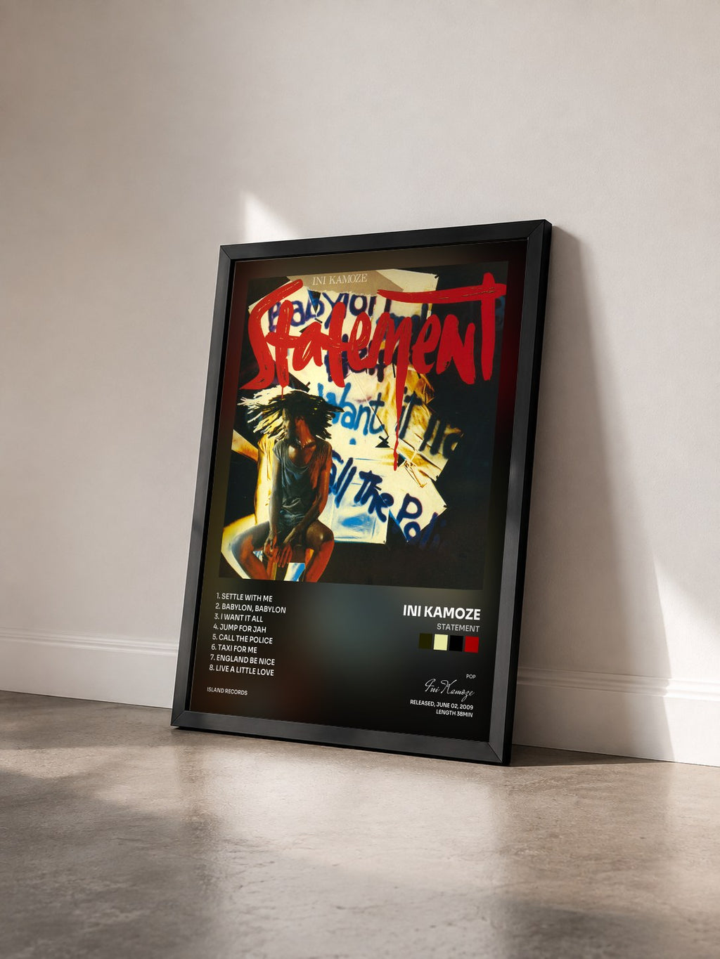 #noir Tableau de l'album Statement de Ini Kamoze vu de trois quarts, cadre noir