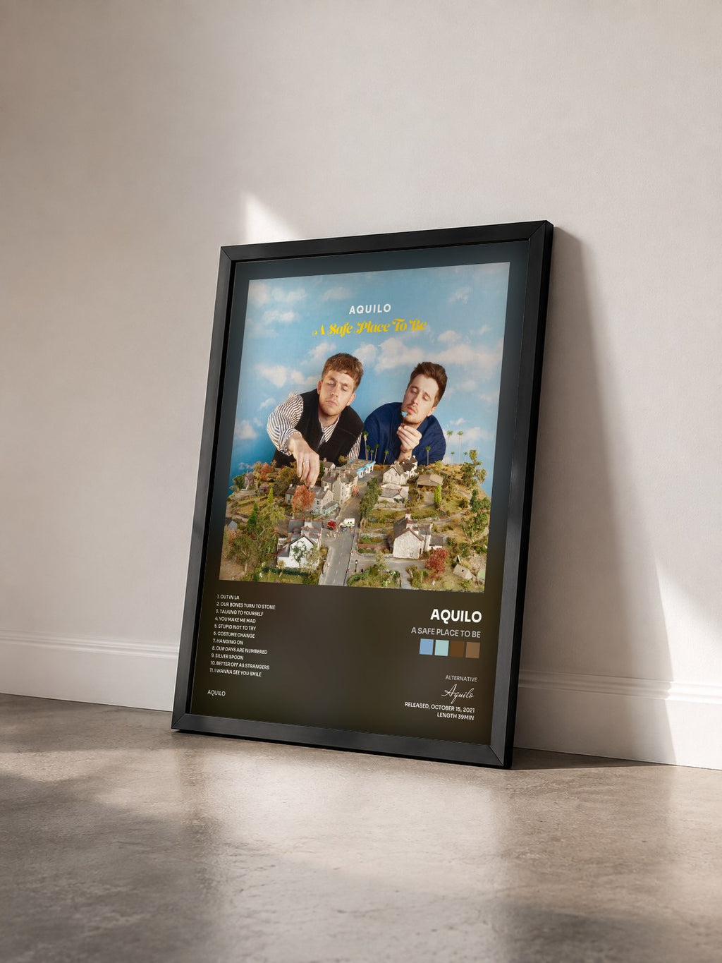 #noir Tableau de l'album A Safe Place To Be de Aquilo vu de trois quarts, cadre noir