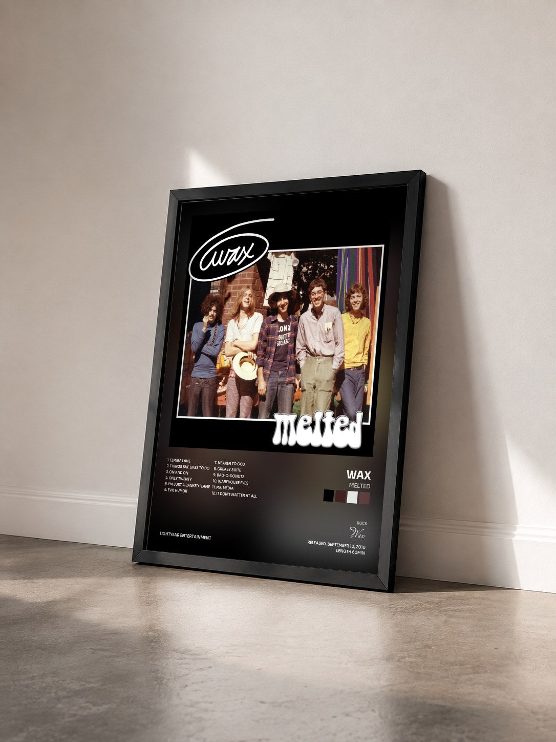 #noir Tableau de l'album Melted de Wax vu de trois quarts, cadre noir