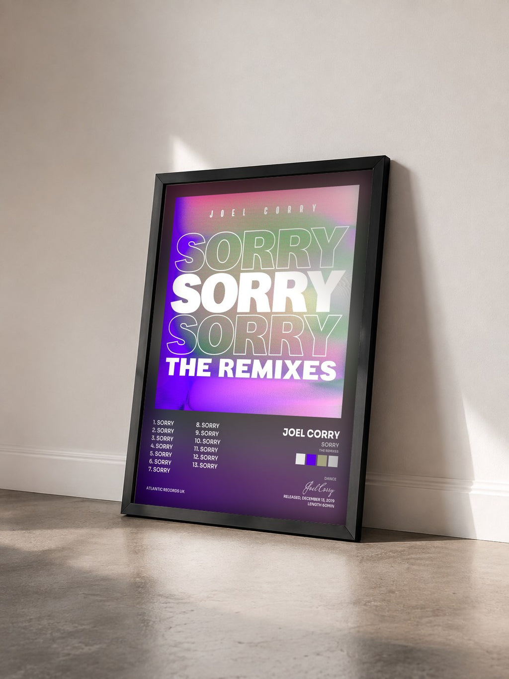 #noir Tableau de l'album Sorry (The Remixes) de Joel Corry vu de trois quarts, cadre noir