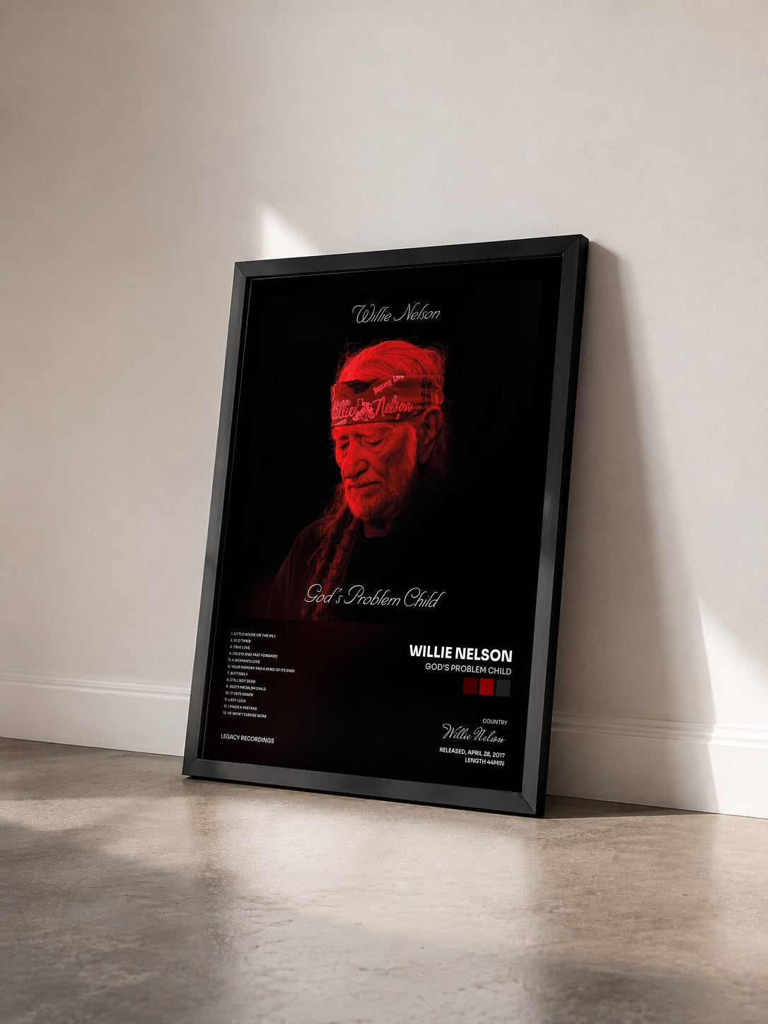 #noir Tableau de l'album God's Problem Child de Willie Nelson vu de trois quarts, cadre noir