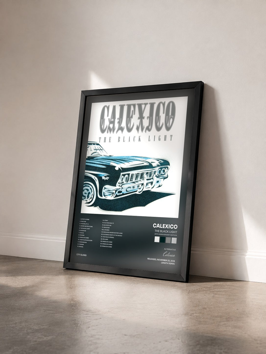 #noir Tableau de l'album The Black Light (20th Anniversary Edition) de Calexico vu de trois quarts, cadre noir