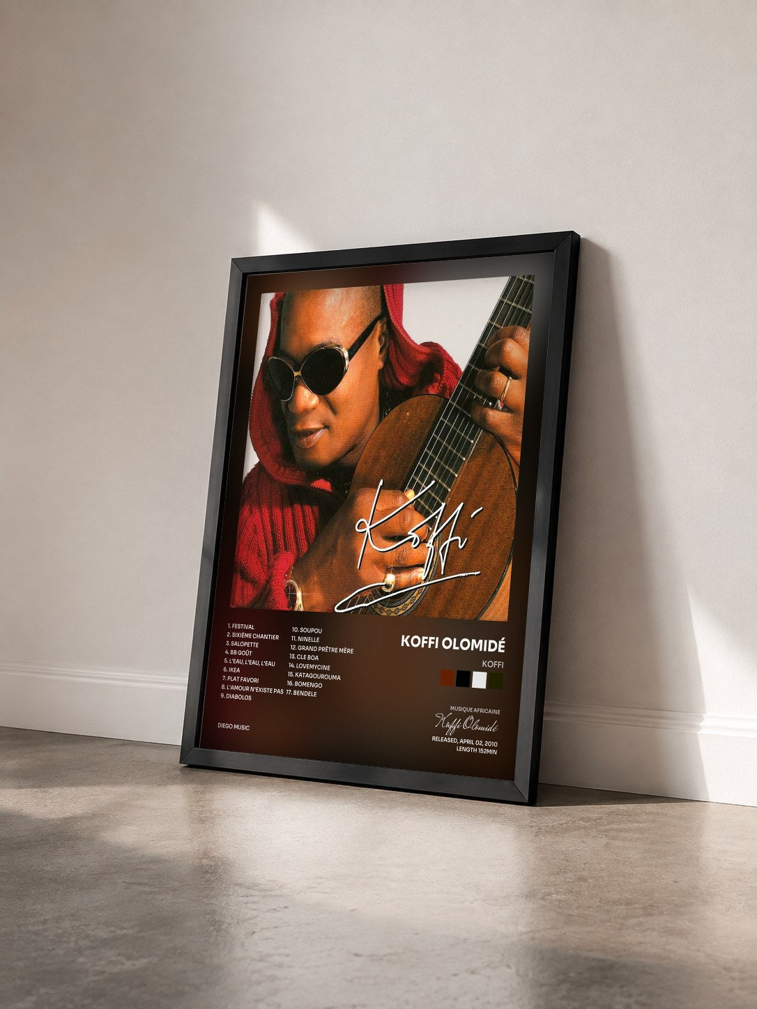 #noir Tableau de l'album Koffi de Koffi Olomidé vu de trois quarts, cadre noir
