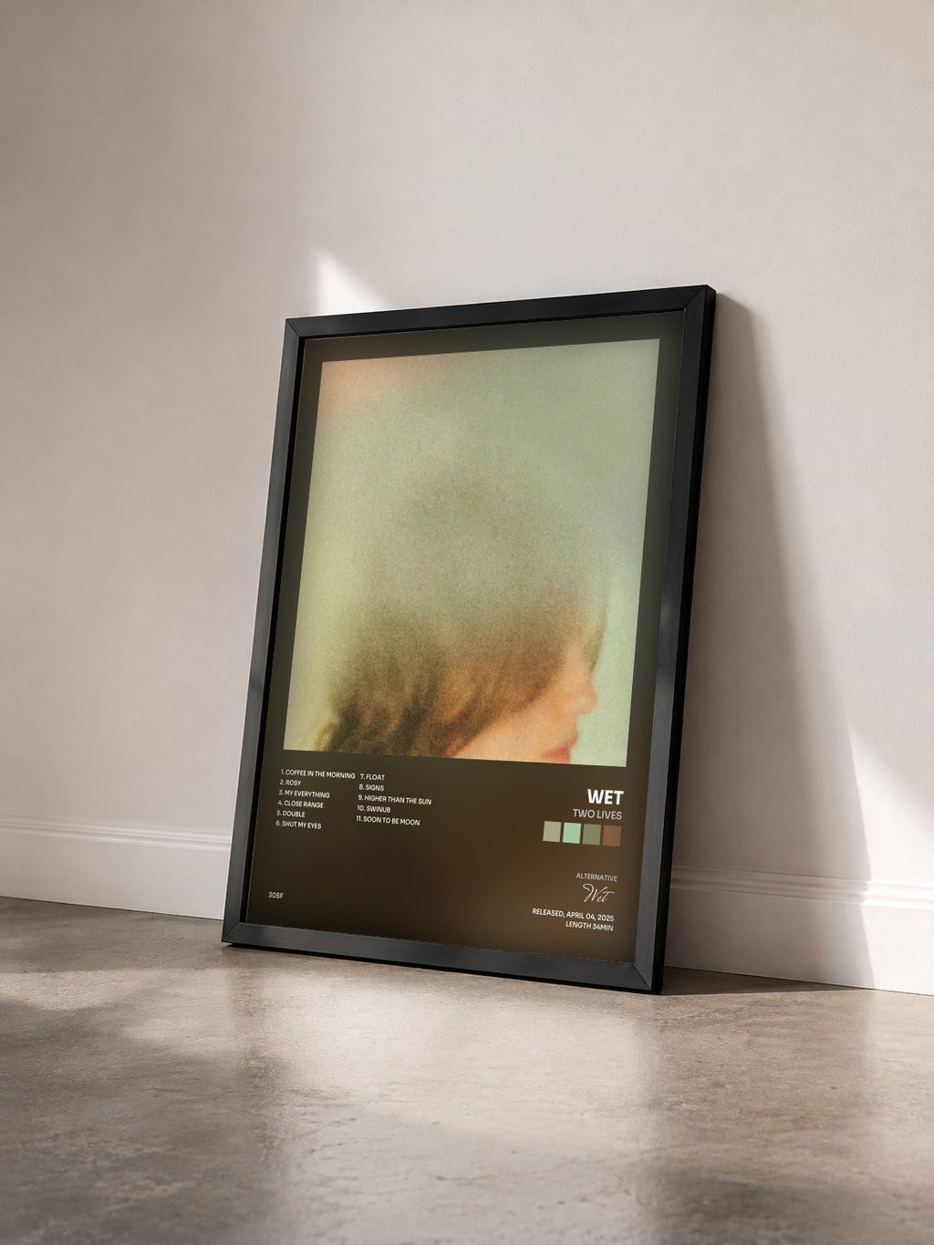 #noir Tableau de l'album Two Lives de Wet vu de trois quarts, cadre noir