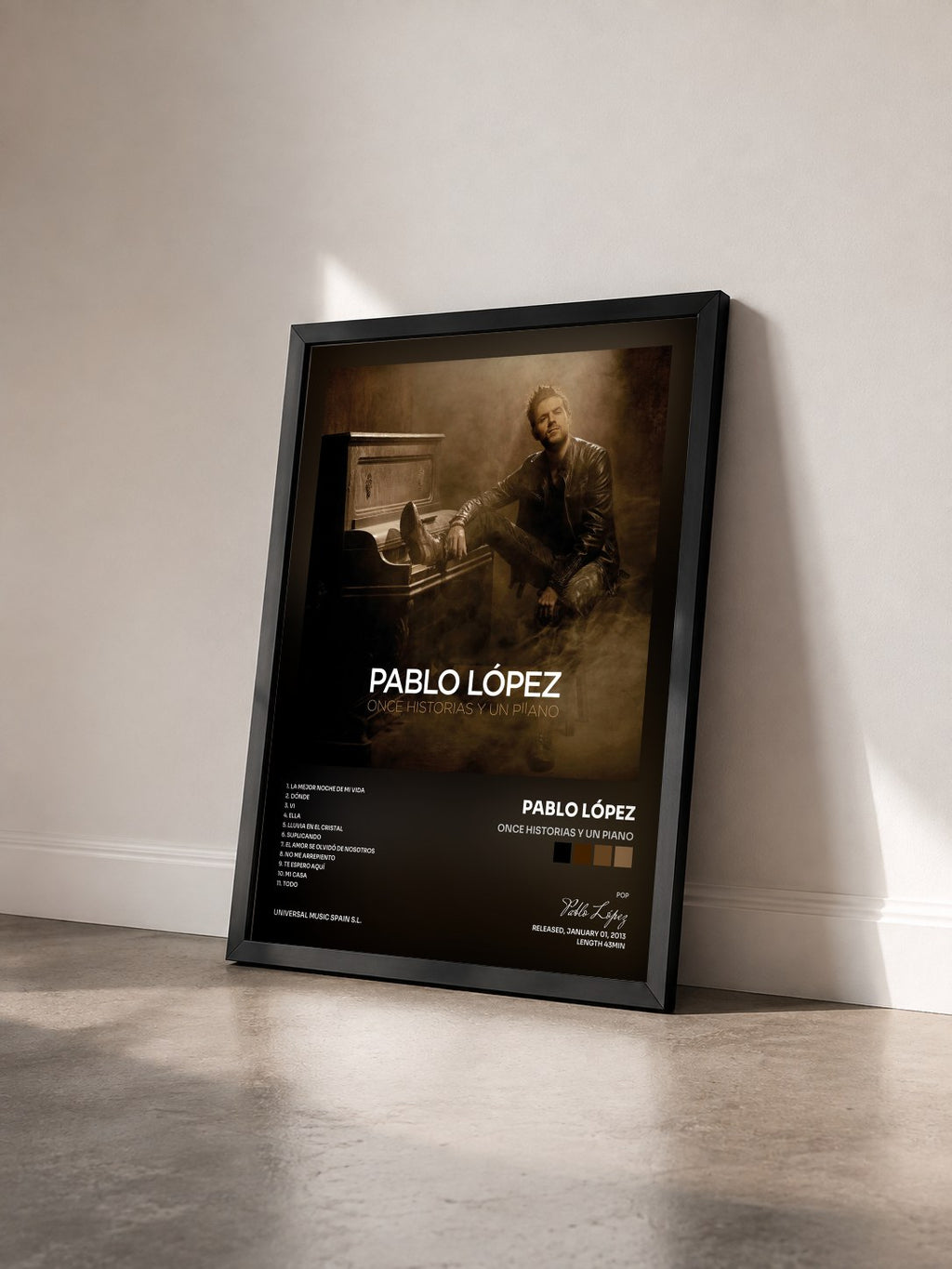 #noir Tableau de l'album Once Historias Y Un Piano de Pablo López vu de trois quarts, cadre noir