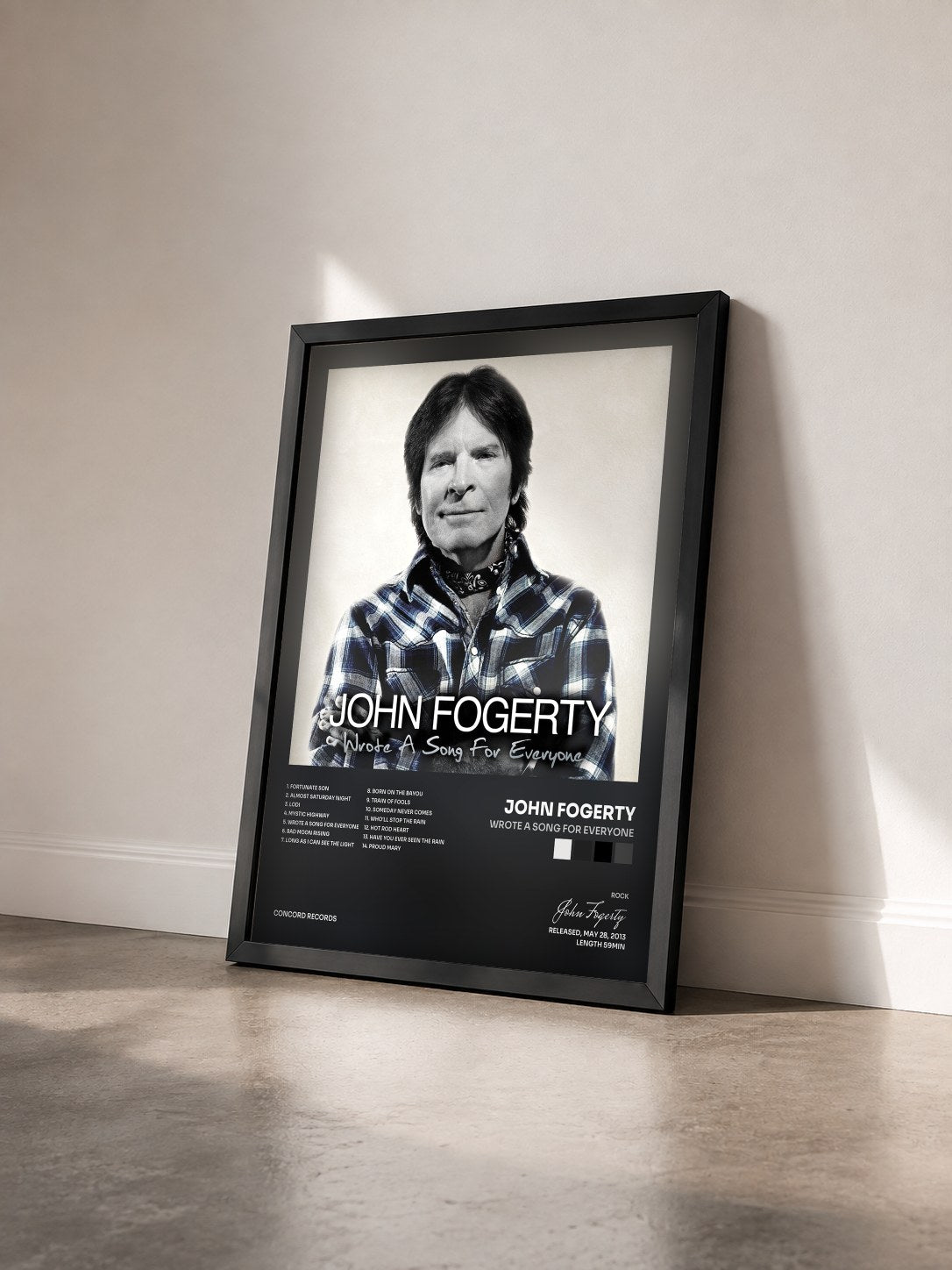 #noir Tableau de l'album Wrote A Song For Everyone de John Fogerty vu de trois quarts, cadre noir