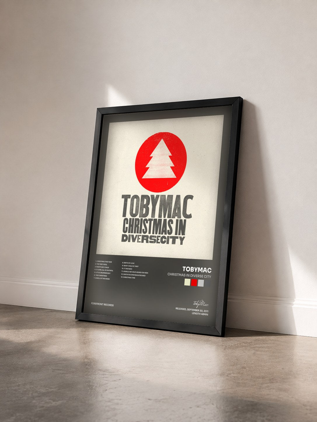 #noir Tableau de l'album Christmas in Diverse City de tobyMac vu de trois quarts, cadre noir