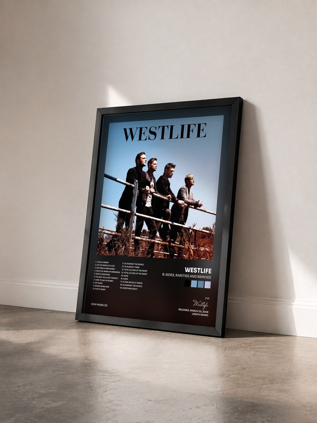 #noir Tableau de l'album B-Sides, Rarities and Remixes de Westlife vu de trois quarts, cadre noir