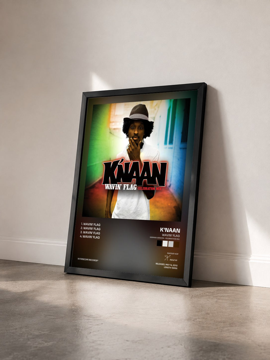 #noir Tableau de l'album Wavin' Flag (German Version - Celebration Mix) de K'naan vu de trois quarts, cadre noir