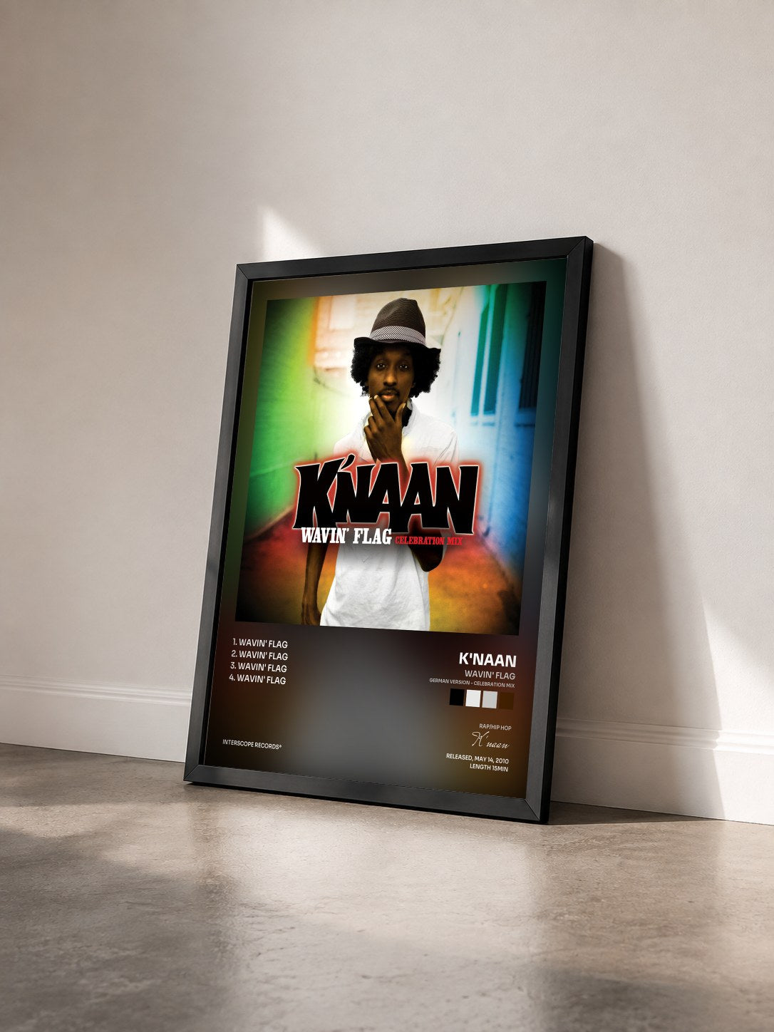 #noir Tableau de l'album Wavin' Flag (German Version - Celebration Mix) de K'naan vu de trois quarts, cadre noir