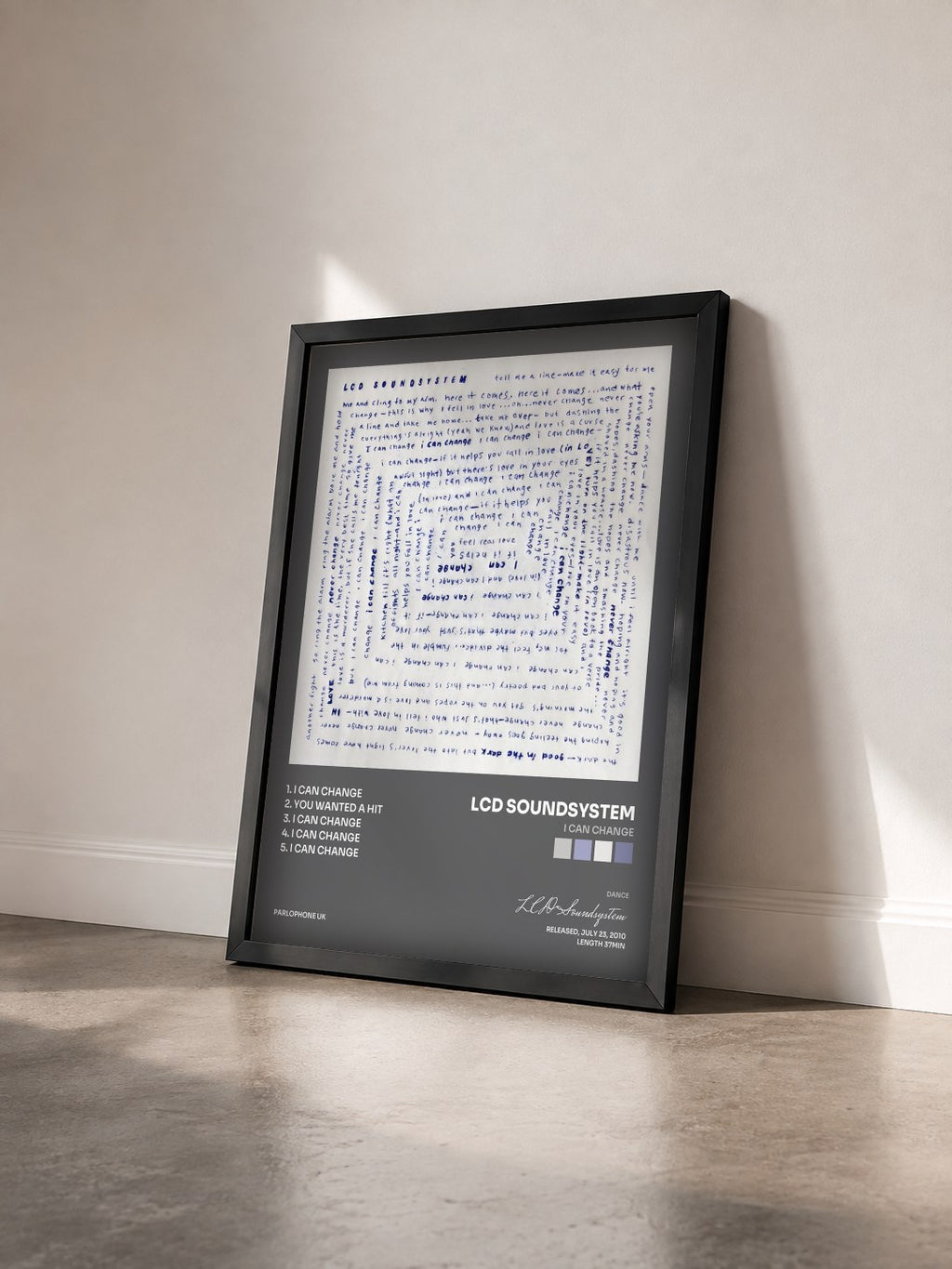 #noir Tableau de l'album I Can Change de LCD Soundsystem vu de trois quarts, cadre noir