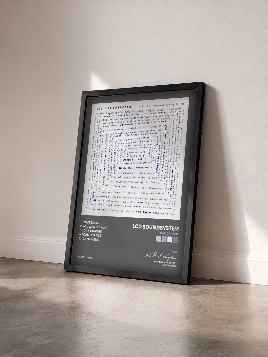 #noir Tableau de l'album I Can Change de LCD Soundsystem vu de trois quarts, cadre noir