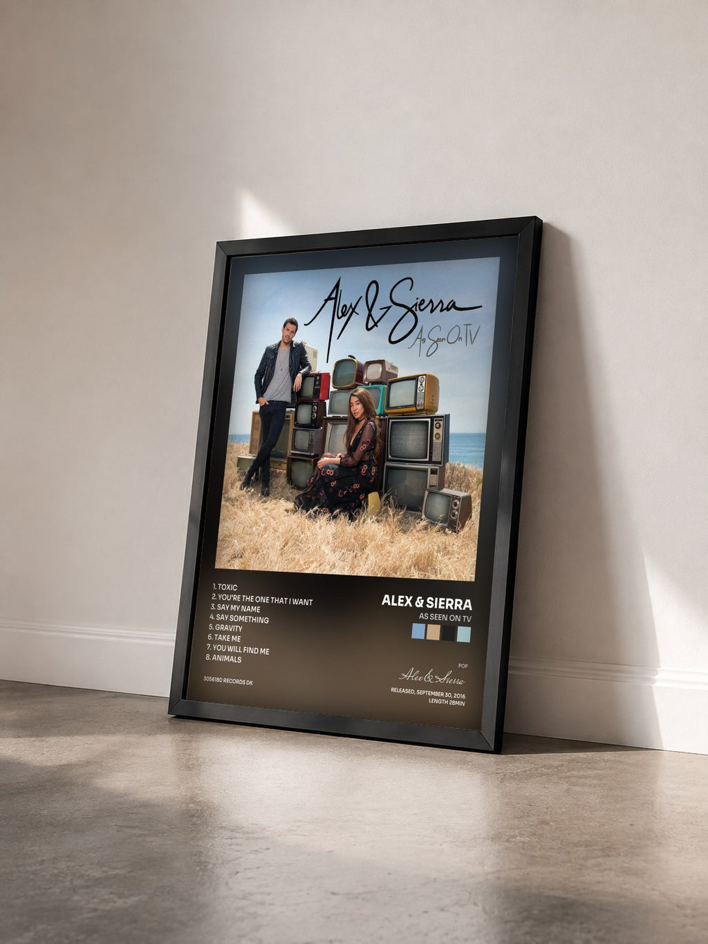 #noir Tableau de l'album As Seen On TV de Alex & Sierra vu de trois quarts, cadre noir