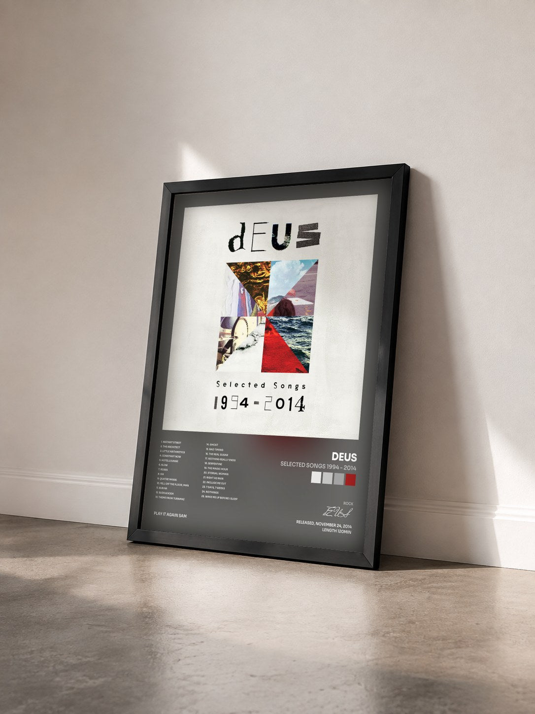 #noir Tableau de l'album Selected Songs 1994 - 2014 de dEUS vu de trois quarts, cadre noir