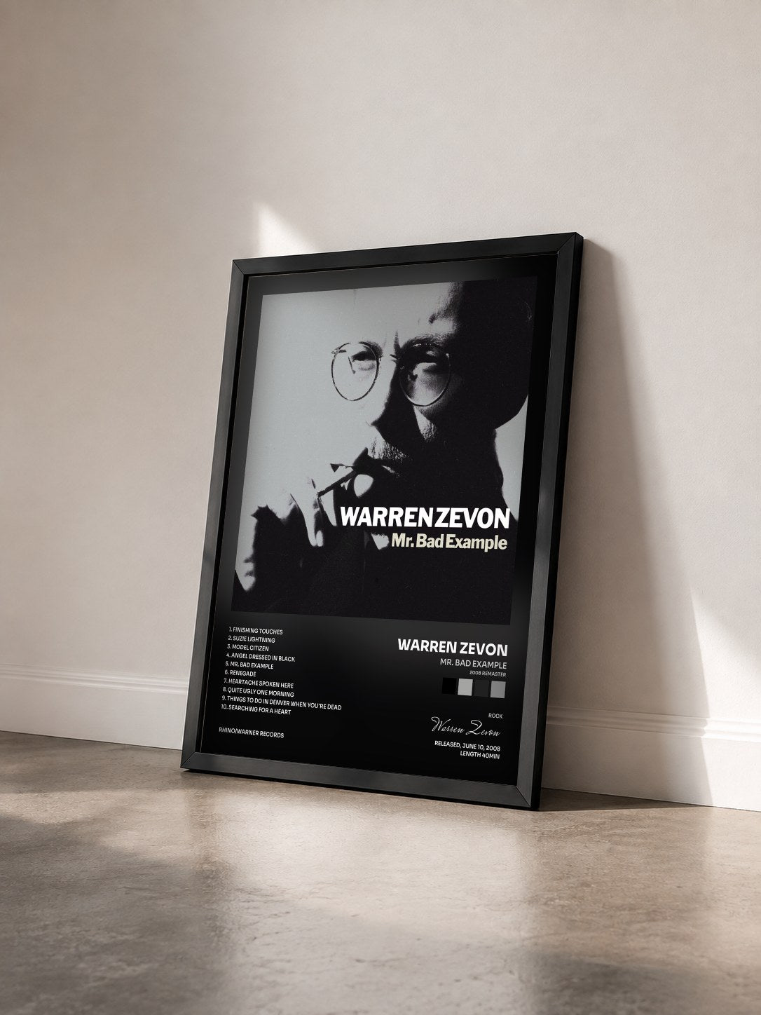 #noir Tableau de l'album Mr. Bad Example (2008 Remaster) de Warren Zevon vu de trois quarts, cadre noir